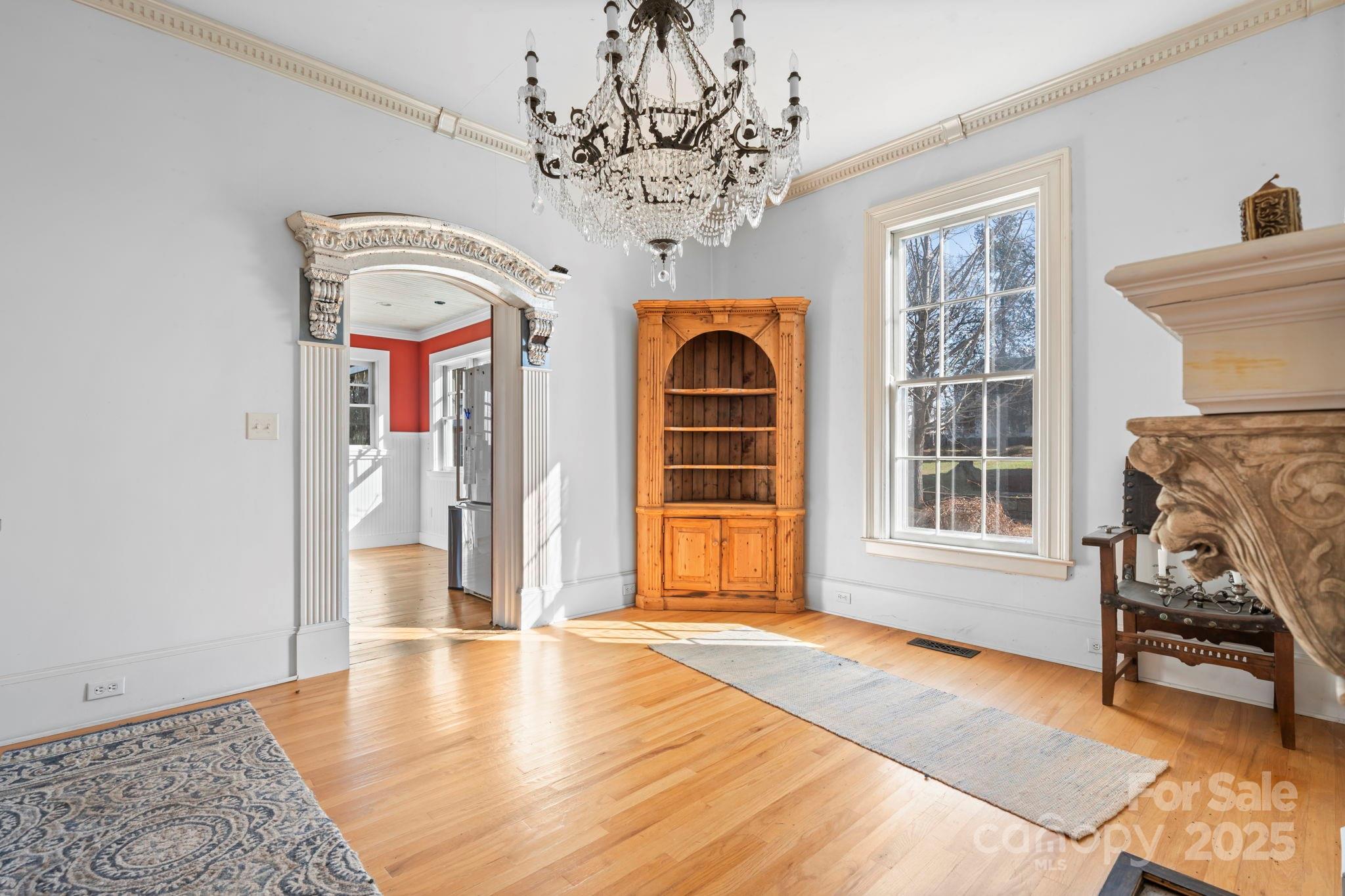 335 Eastview Street Morganton, NC 28655 - Photo 19 of 34 a view of livingroom with furniture window and wooden floor