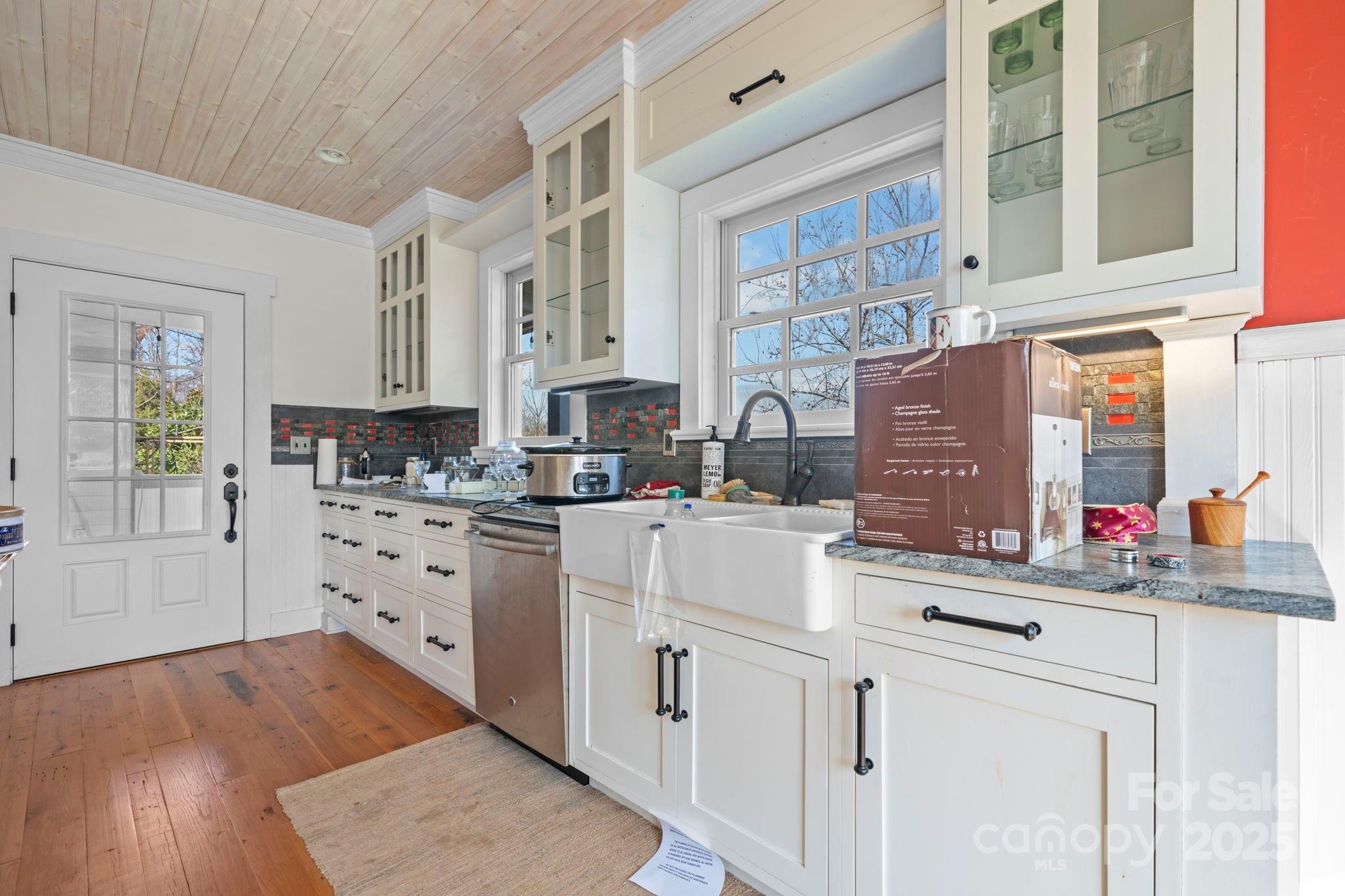 335 Eastview Street Morganton, NC 28655 - Photo 22 of 34 a kitchen with cabinets appliances a sink and a counter top space
