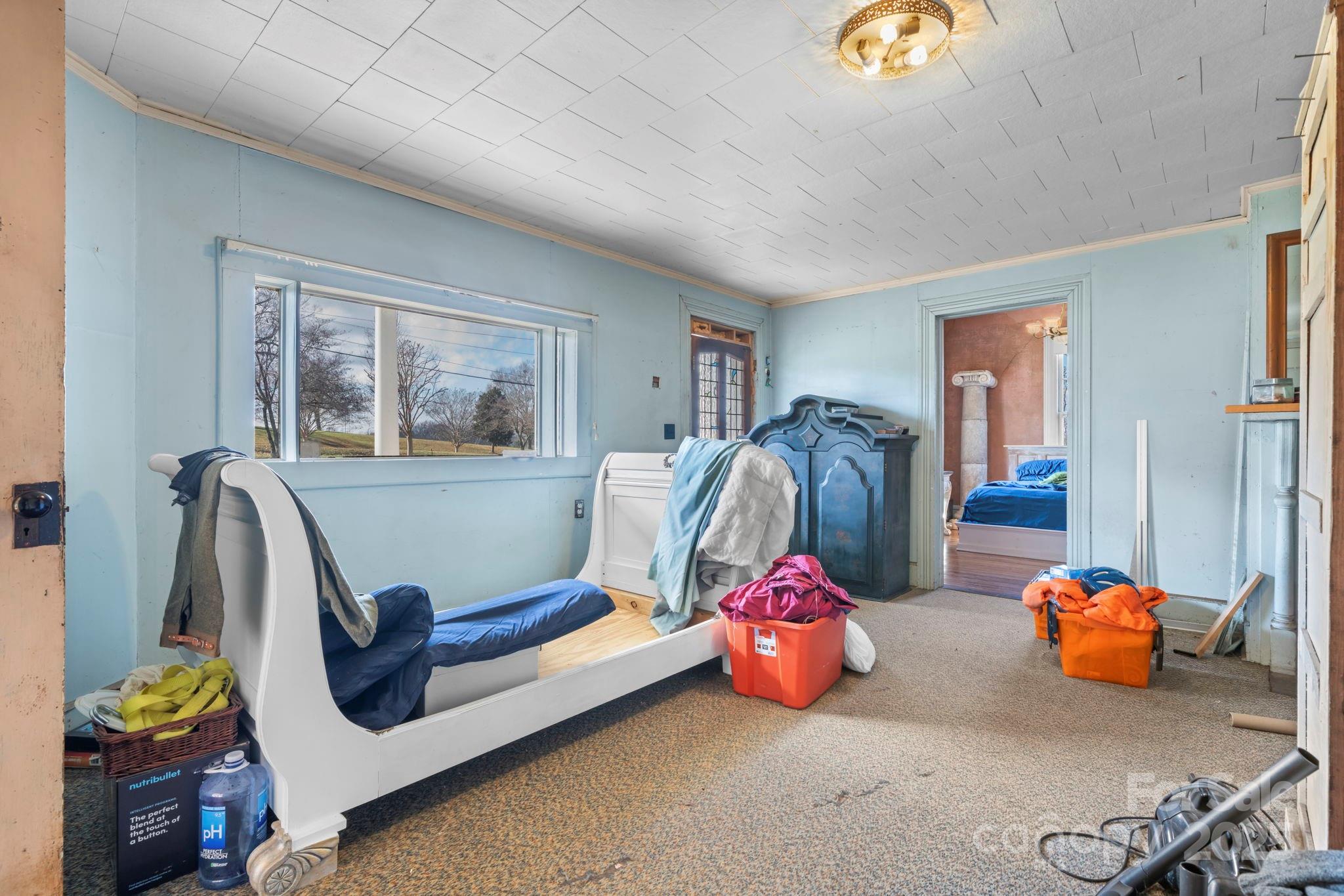 335 Eastview Street Morganton, NC 28655 - Photo 26 of 34 a bedroom with bed and a window