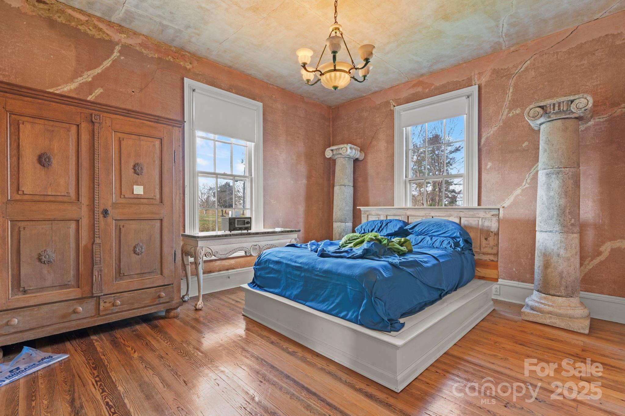 335 Eastview Street Morganton, NC 28655 - Photo 27 of 34 a living room with hard wood floors and a dresser