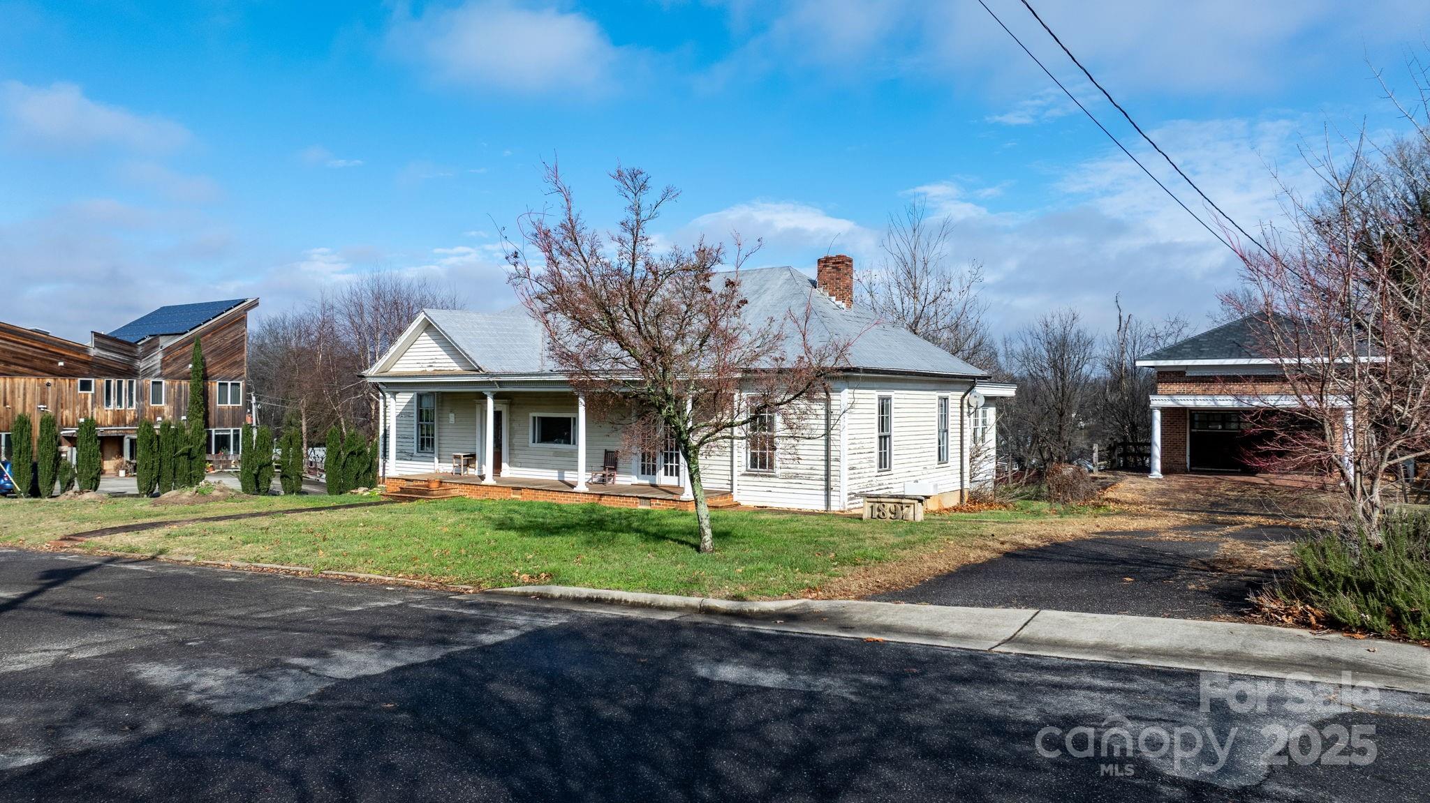 335 Eastview Street Morganton, NC 28655 - Photo 3 of 34 a front view of a house with a yard
