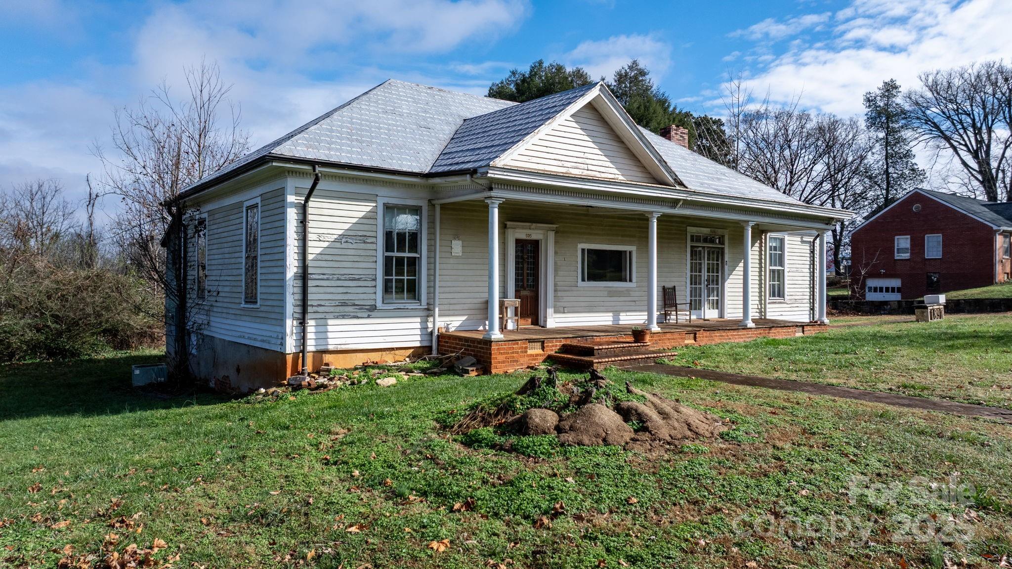 335 Eastview Street Morganton, NC 28655 - Photo 4 of 34 a front view of a house with a yard and porch