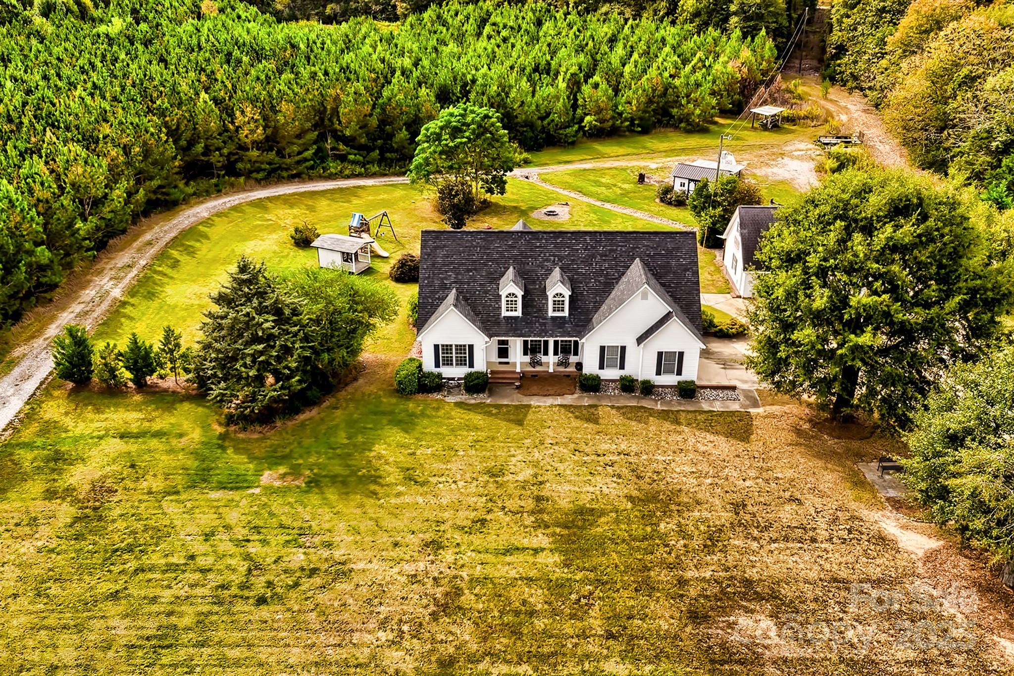 a view of swimming pool with outdoor seating and yard