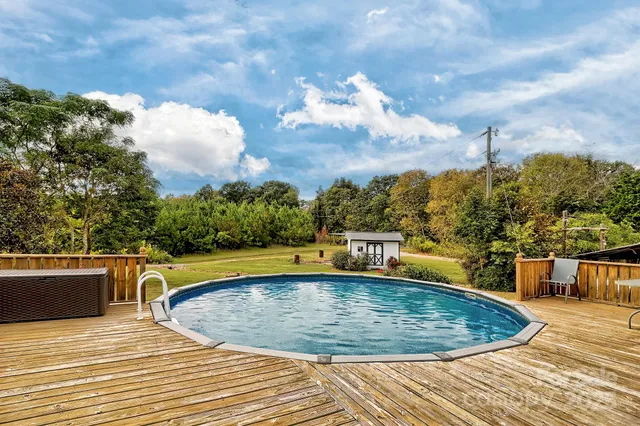 a view of a swimming pool with a lounge chair