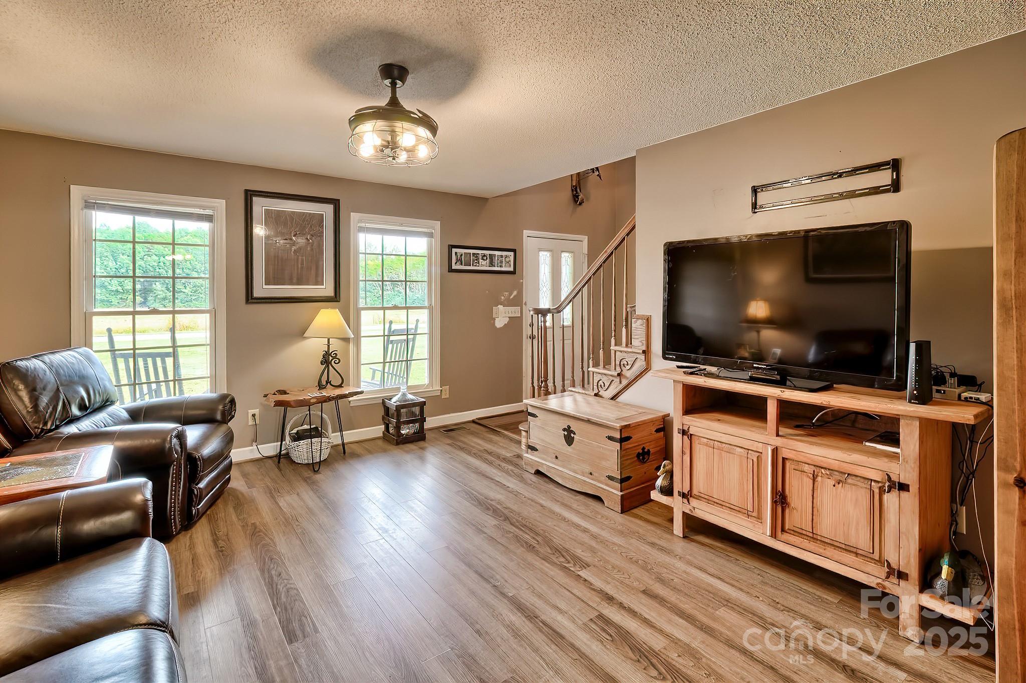 176 Griffin Road Pageland, SC 29728 - Photo 23 of 46 a living room with furniture and a flat screen tv