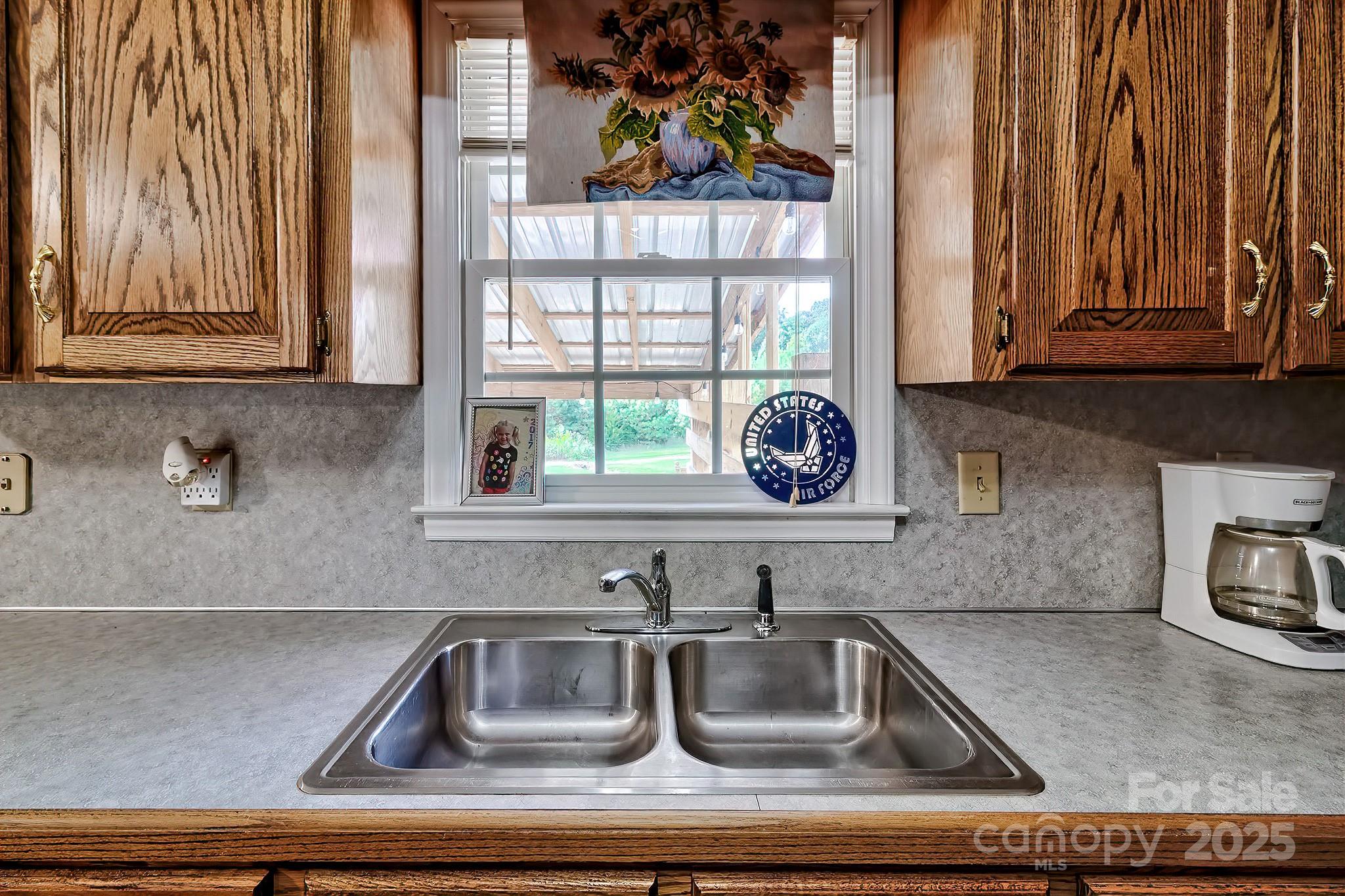 176 Griffin Road Pageland, SC 29728 - Photo 30 of 46 a kitchen with a sink and cabinets