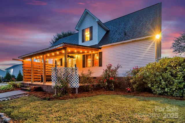 a view of a house with backyard porch and sitting area