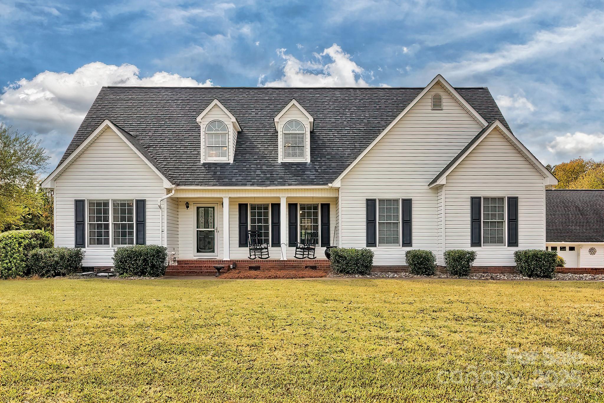 176 Griffin Road Pageland, SC 29728 - Photo 8 of 46 a front view of house with yard outdoor seating and barbeque oven