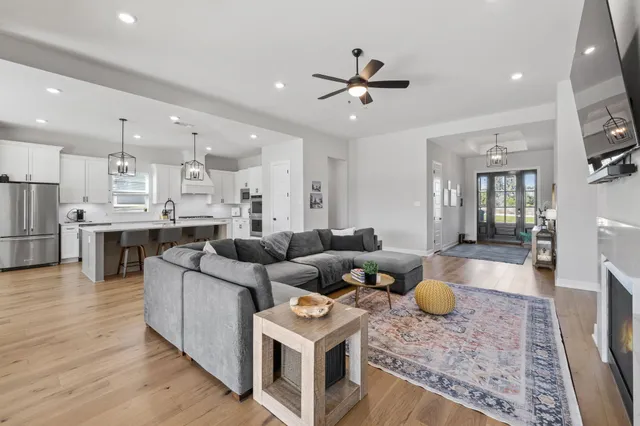 an aerial view of residential house with outdoor space and swimming pool