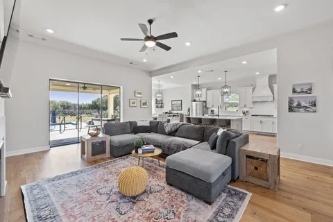 a view of swimming pool with outdoor seating and yard