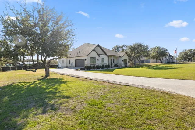 a aerial view of a house with a yard