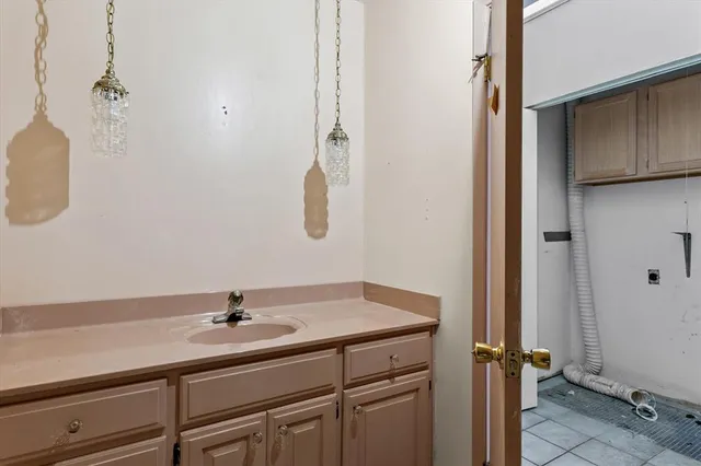 a bathroom with a sink and mirror