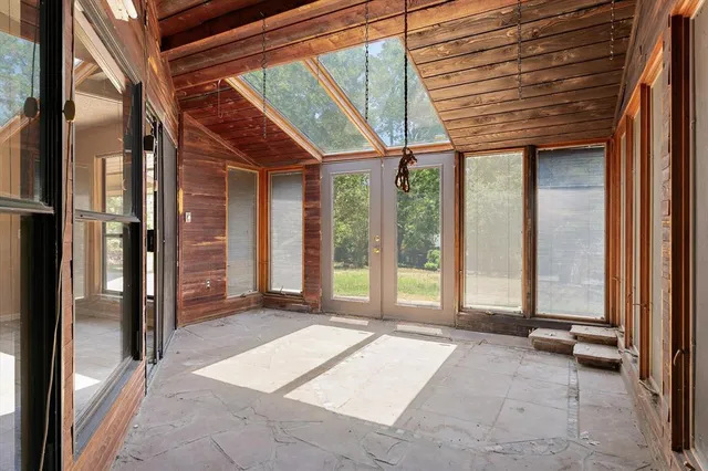 a view of a room with large windows