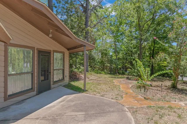 a backyard of a house with seating space