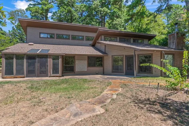front view of a house with a garden