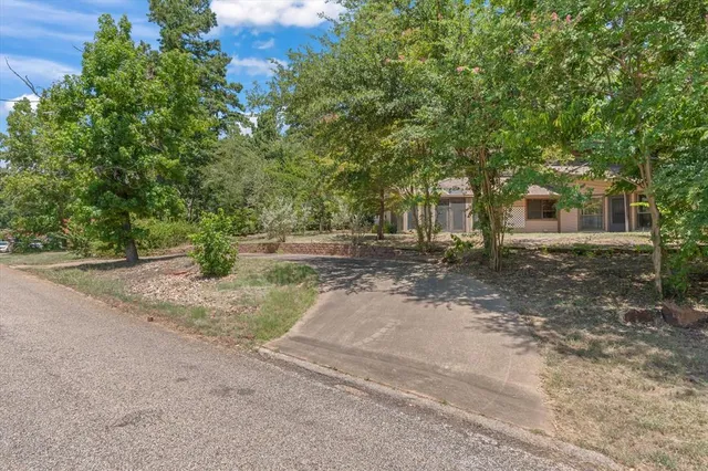 a backyard of a house with fountain and outdoor space