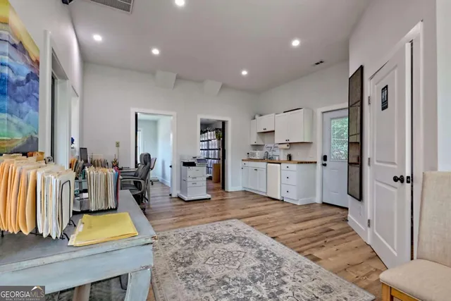 a bathroom with a toilet a sink and a mirror