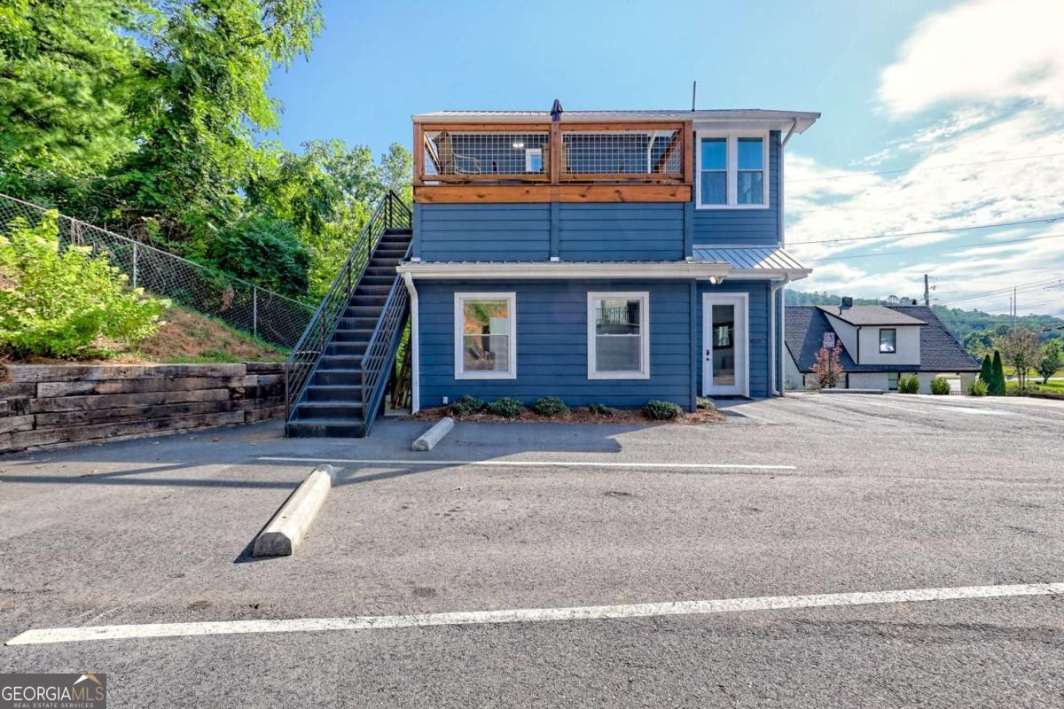 25 Valley Street Clayton, GA 30525 - Photo 30 of 81 a front view of a house with garage