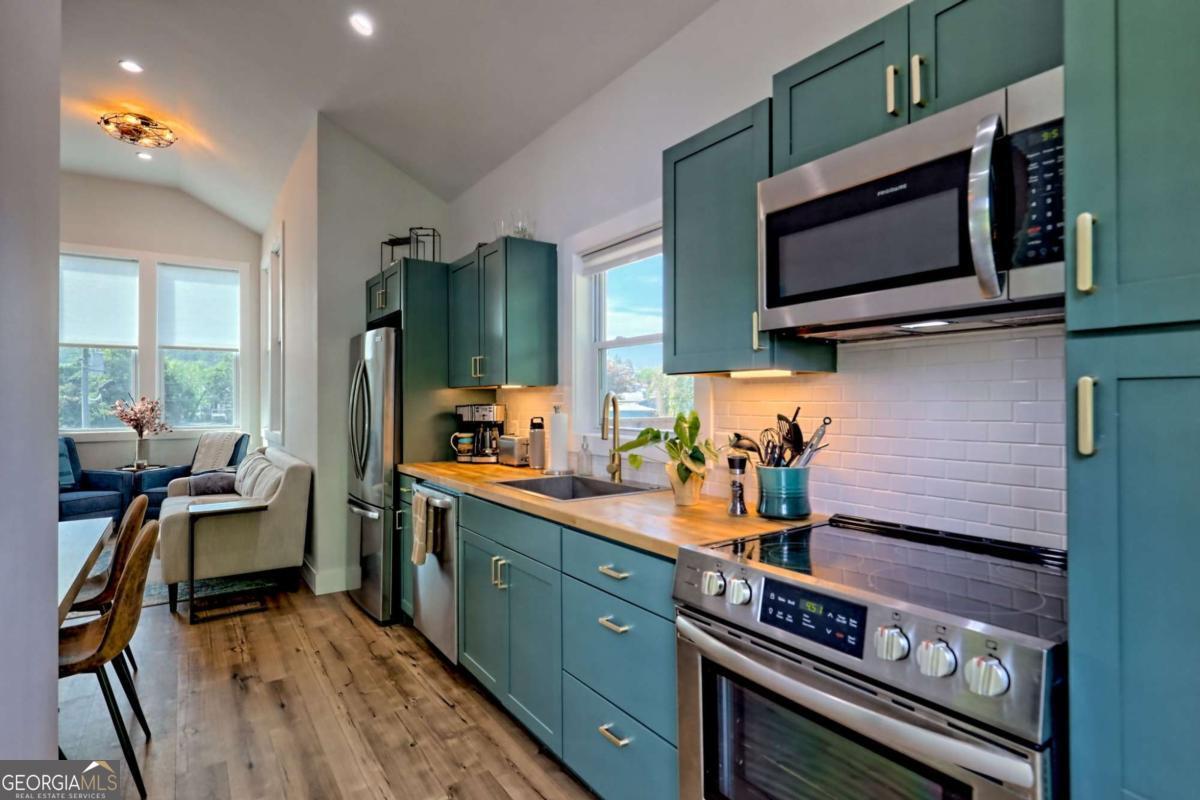 25 Valley Street Clayton, GA 30525 - Photo 37 of 81 a kitchen with a stove and a microwave