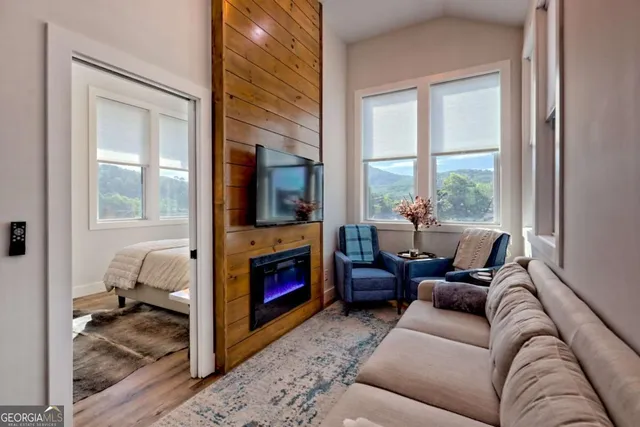 an aerial view of a house with garden space and sitting area