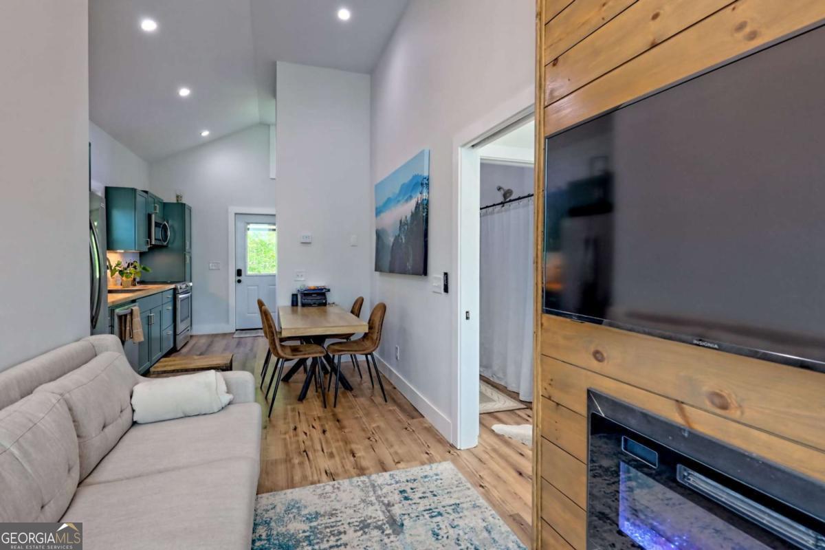 25 Valley Street Clayton, GA 30525 - Photo 43 of 81 a living room with furniture and a flat screen tv