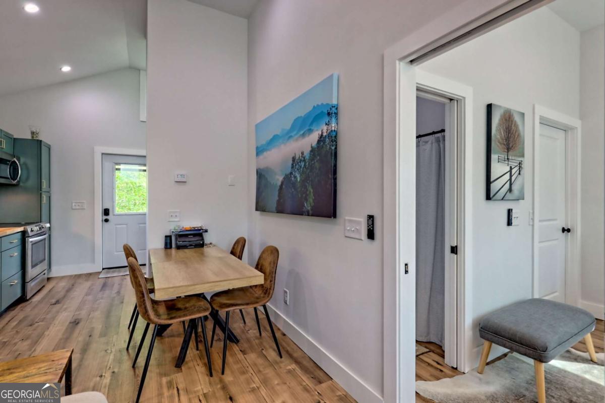 25 Valley Street Clayton, GA 30525 - Photo 44 of 81 a view of a dining room with furniture and wooden floor