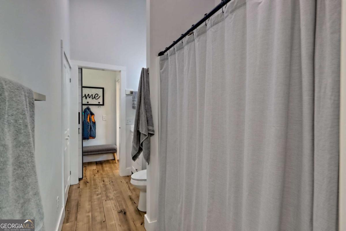 25 Valley Street Clayton, GA 30525 - Photo 49 of 81 a walk in closet with wooden floor