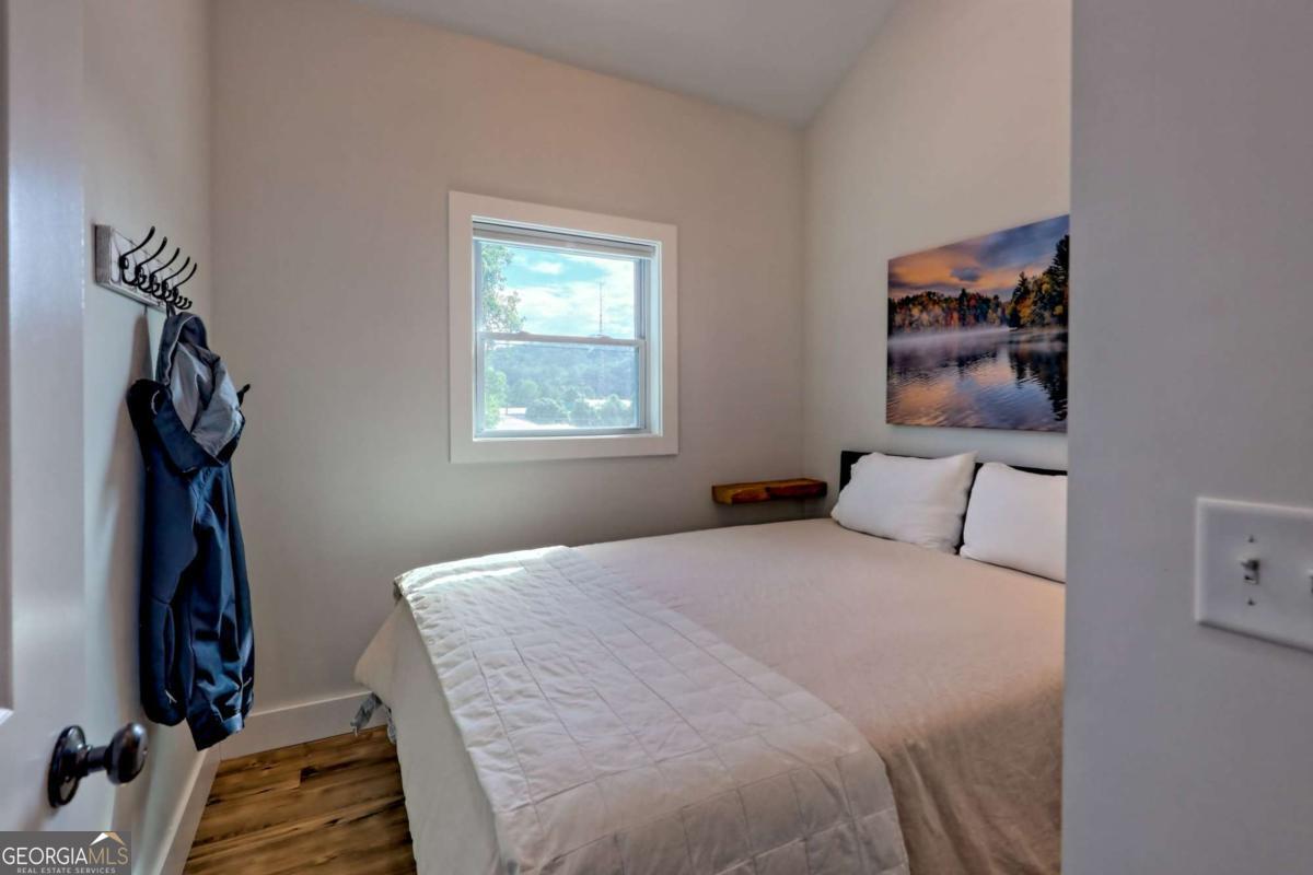 25 Valley Street Clayton, GA 30525 - Photo 53 of 81 a bedroom with a bed and a window