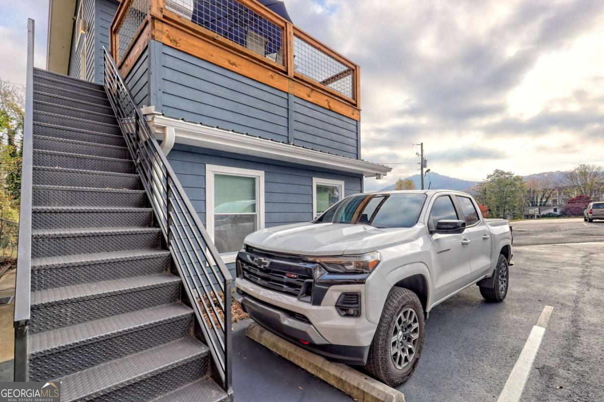 25 Valley Street Clayton, GA 30525 - Photo 72 of 81 a car parked in front of white house