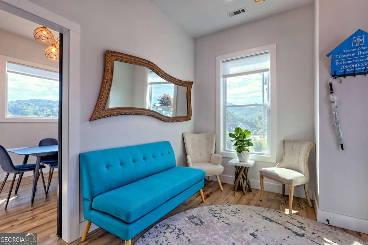 25 Valley Street Clayton, GA 30525 - Photo 8 of 81 a living room with furniture and a window