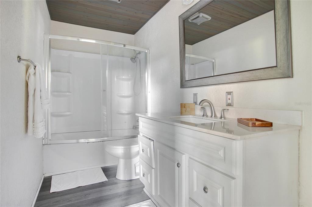 35 South Lake Fox Road Winter Haven, FL 33884 - Photo 24 of 43 a bathroom with a sink a toilet and shower