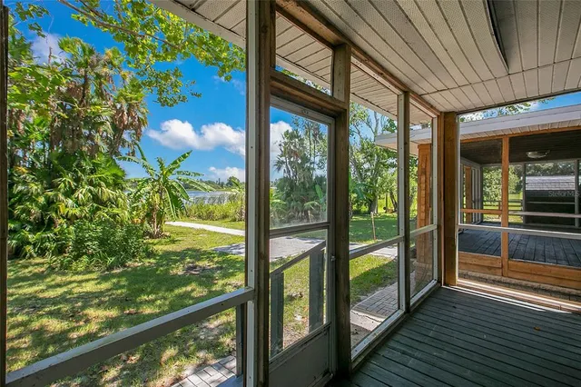 a view of a glass door with a floor to ceiling window