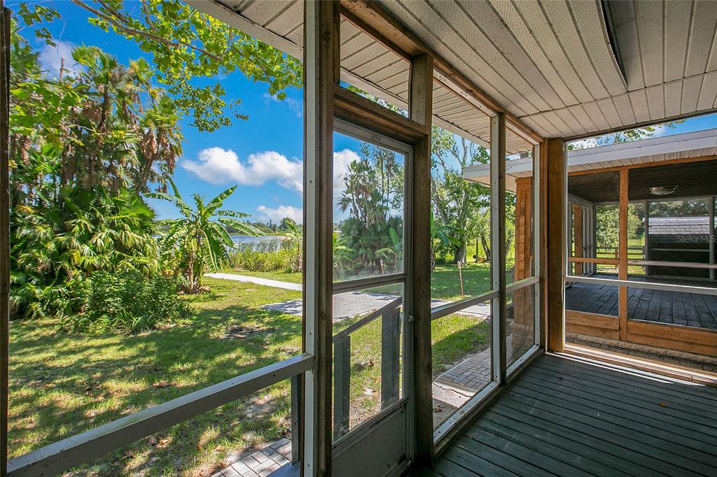35 South Lake Fox Road Winter Haven, FL 33884 - Photo 30 of 43 a view of a glass door with a floor to ceiling window