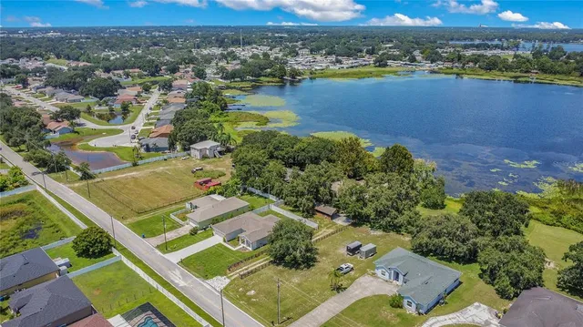 an aerial view of lake residential house with outdoor space