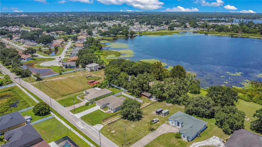 35 South Lake Fox Road Winter Haven, FL 33884 - Photo 39 of 43 an aerial view of lake residential house with outdoor space