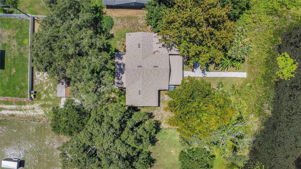 35 South Lake Fox Road Winter Haven, FL 33884 - Photo 41 of 43 an aerial view of a house with a yard and garden