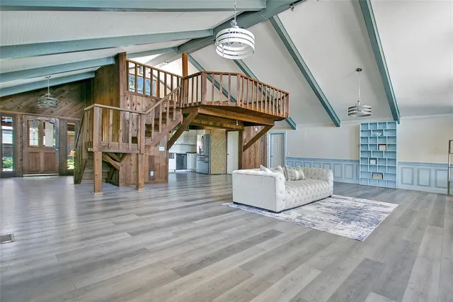a view of entryway livingroom and hall with wooden floor