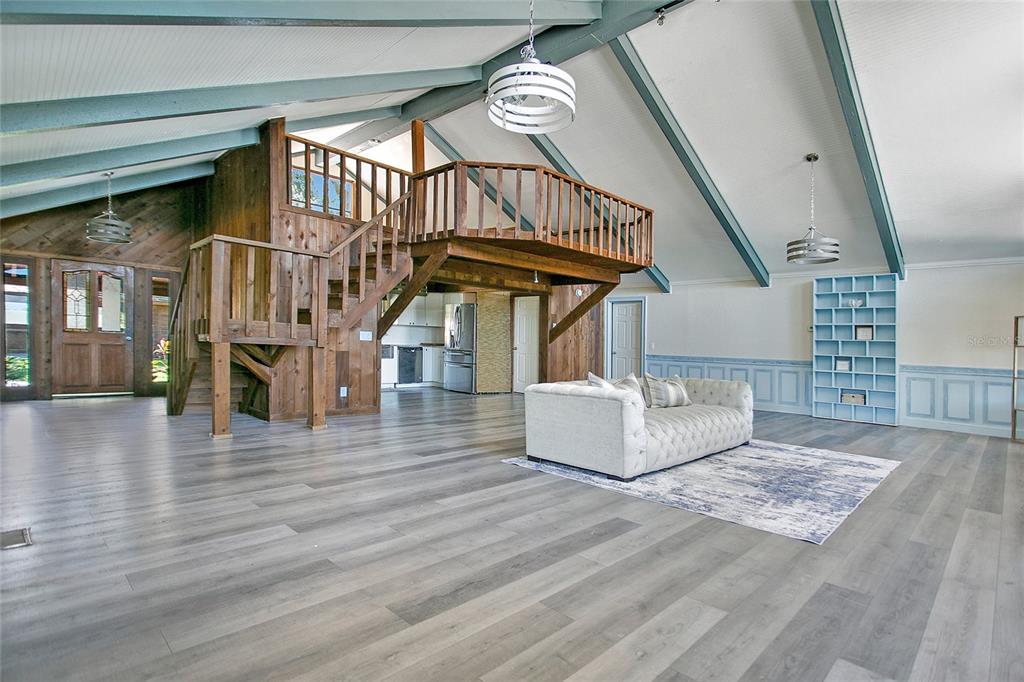 35 South Lake Fox Road Winter Haven, FL 33884 - Photo 8 of 43 a view of entryway livingroom and hall with wooden floor