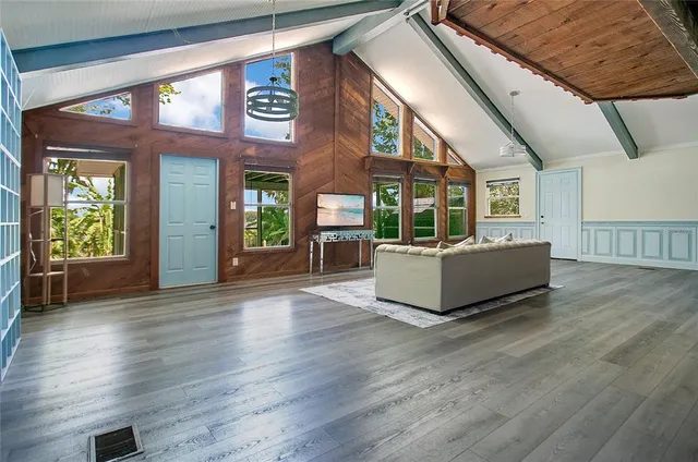 a view of a building with couch and wooden floor