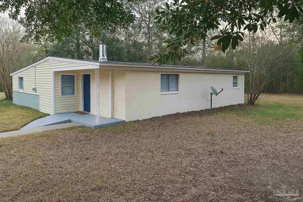a house with trees in the background