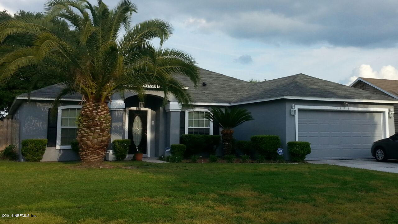 3493 White Wing Road Orange Park, FL 32073 - Photo 1 of 27 a front view of a house with garden