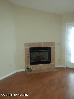 3493 White Wing Road Orange Park, FL 32073 - Photo 12 of 27 a living room with a fireplace
