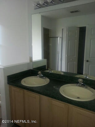 3493 White Wing Road Orange Park, FL 32073 - Photo 13 of 27 a bathroom with a sink and a mirror