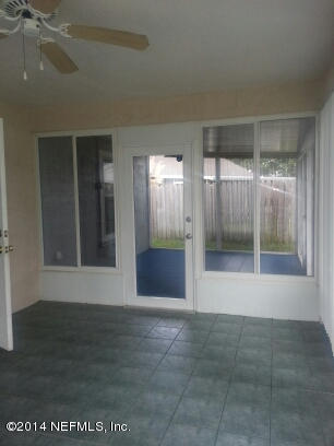 3493 White Wing Road Orange Park, FL 32073 - Photo 16 of 27 a view of an empty room with glass door