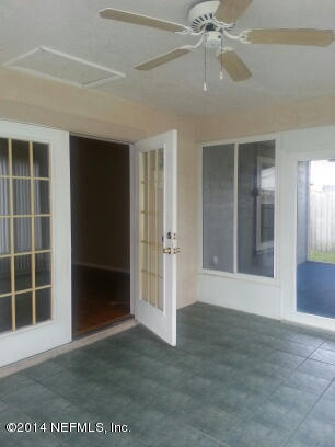 3493 White Wing Road Orange Park, FL 32073 - Photo 17 of 27 an empty room with windows and entrance