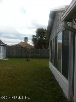 3493 White Wing Road Orange Park, FL 32073 - Photo 18 of 27 a backyard of a house with lots of green space