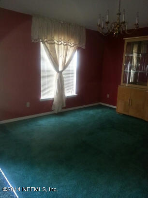3493 White Wing Road Orange Park, FL 32073 - Photo 2 of 27 an empty room with windows