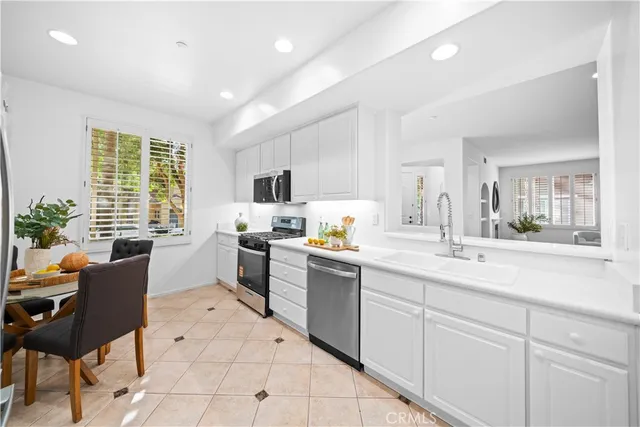 a kitchen with sink cabinets and window