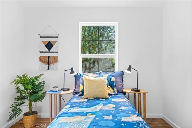 a bed room with furniture and a window