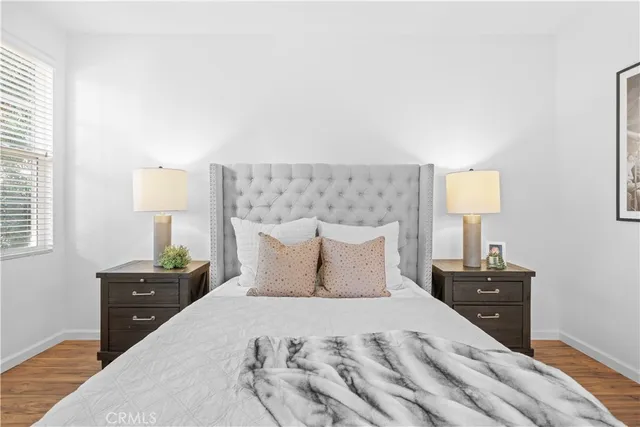 a bedroom with a bed and window